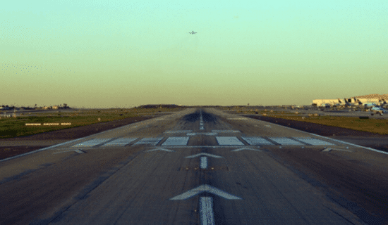 a plane runway at sunset