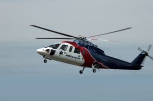 A red, white and blue air ambulance helicopter