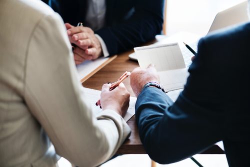 Lawyers sitting around a table discussing cases