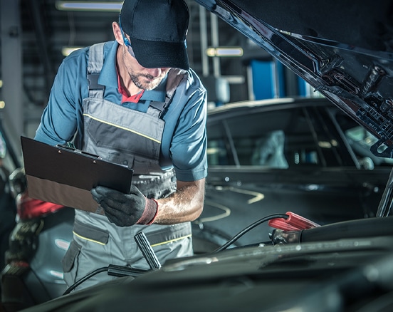 mechanic checking vehicle